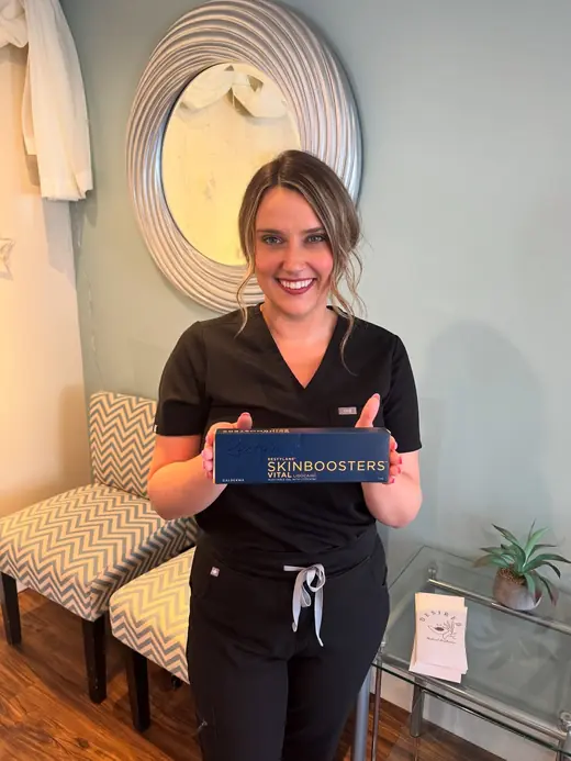 Marley holding a skin booster box in the treatment room