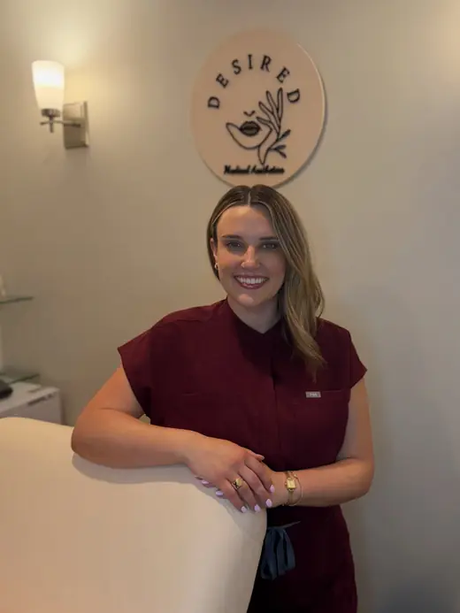 Marley in burgundy scrubs in the treatment room