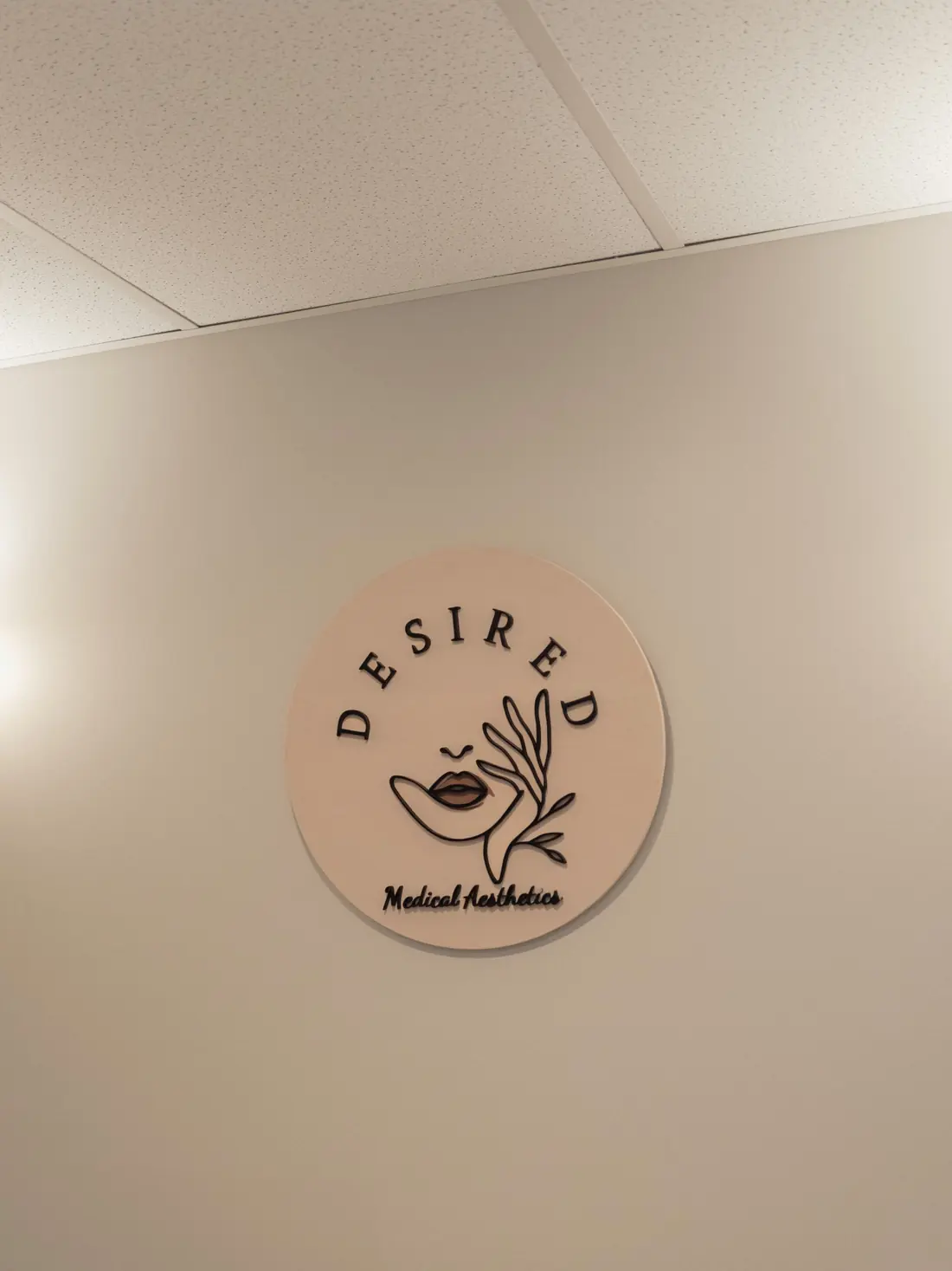 Round Desired sign on the clinic wall